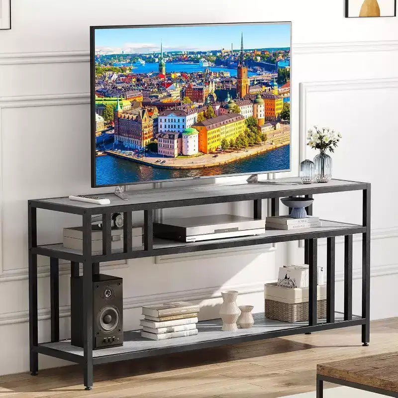 Meuble TV 65 pour téléviseurs jusqu'à 75, centre de divertissement gris avec étagères de rangement ouvertes et support à quadruple tube
