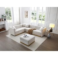 Canapé d'angle en velours beige capitonné avec ottomane et 4 oreillers