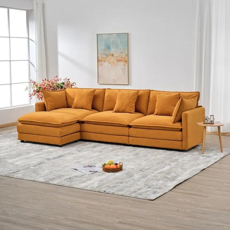 110.2 Canapé trois places capitonné en chenille, pouf