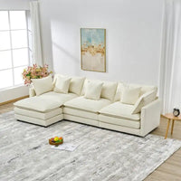 110.2 Canapé trois places capitonné en chenille, pouf