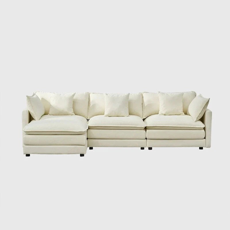 110.2 Canapé trois places capitonné en chenille, pouf
