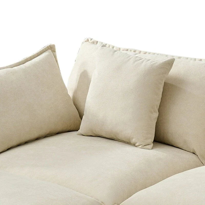 110.2 Canapé trois places capitonné en chenille, pouf