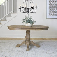 Table à dîner ronde sur pied Magnolia Manor avec rallonges escamotables - 2 finitions