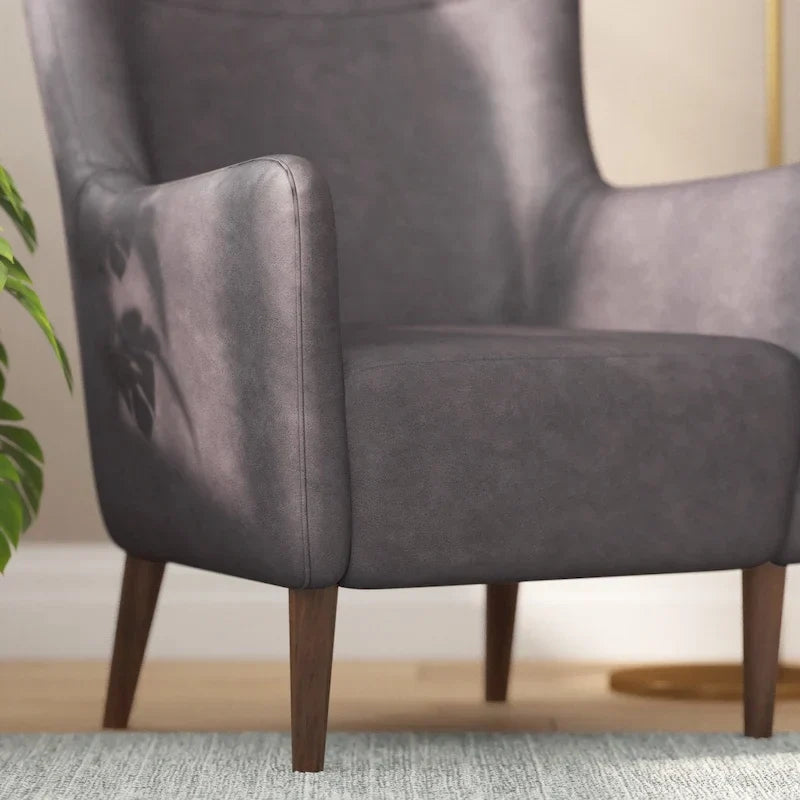 Fauteuil d'appoint capitonné à oreilles avec structure et pieds en bois