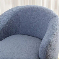 Fauteuil pivotant en tissu bouclette avec anneau en métal thermolaqué