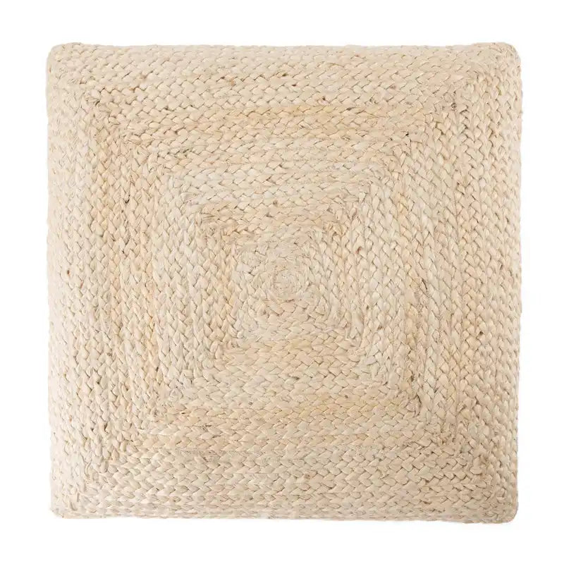 Le pouf/coussin de sol en jute texturé Faxon de Curated Nomad