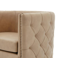Fauteuil pivotant capitonné en cuir pleine fleur Leslie
