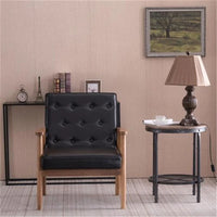 Fauteuil rétro moderne en similicuir noir