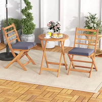 Ensemble de bistro Costway 3 pièces en bois d'acacia pour patio, table et chaises pliantes d'extérieur avec coussins, blanc cassé/bleu marine/gris