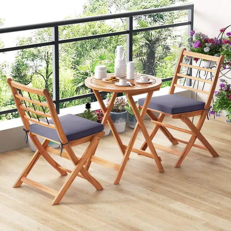 Ensemble de bistro Costway 3 pièces en bois d'acacia pour patio, table et chaises pliantes d'extérieur avec coussins, blanc cassé/bleu marine/gris