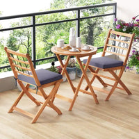 Ensemble de bistro Costway 3 pièces en bois d'acacia pour patio, table et chaises pliantes d'extérieur avec coussins, blanc cassé/bleu marine/gris