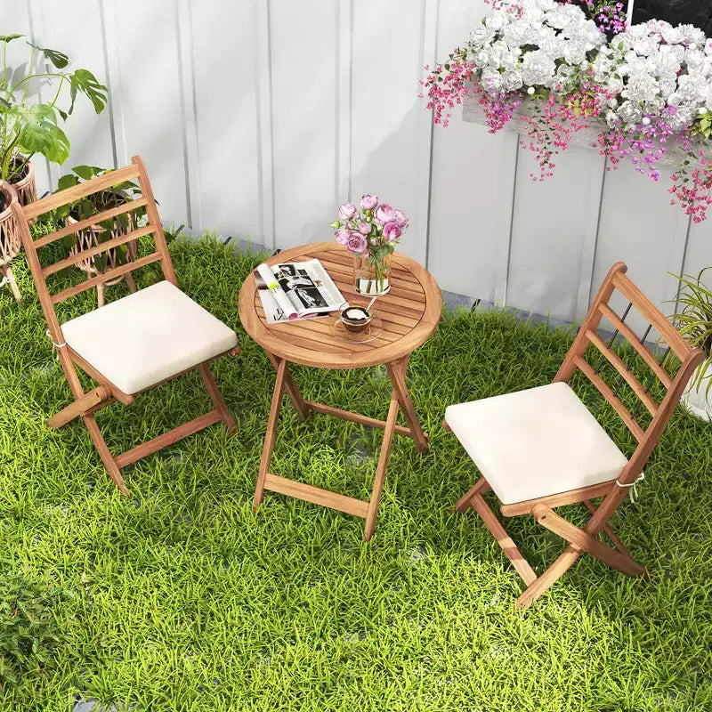 Ensemble de bistro Costway 3 pièces en bois d'acacia pour patio, table et chaises pliantes d'extérieur avec coussins, blanc cassé/bleu marine/gris