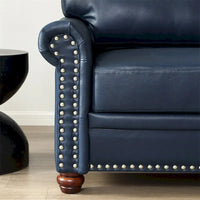 Fauteuil simple en similicuir avec pieds en bois et clous décoratifs